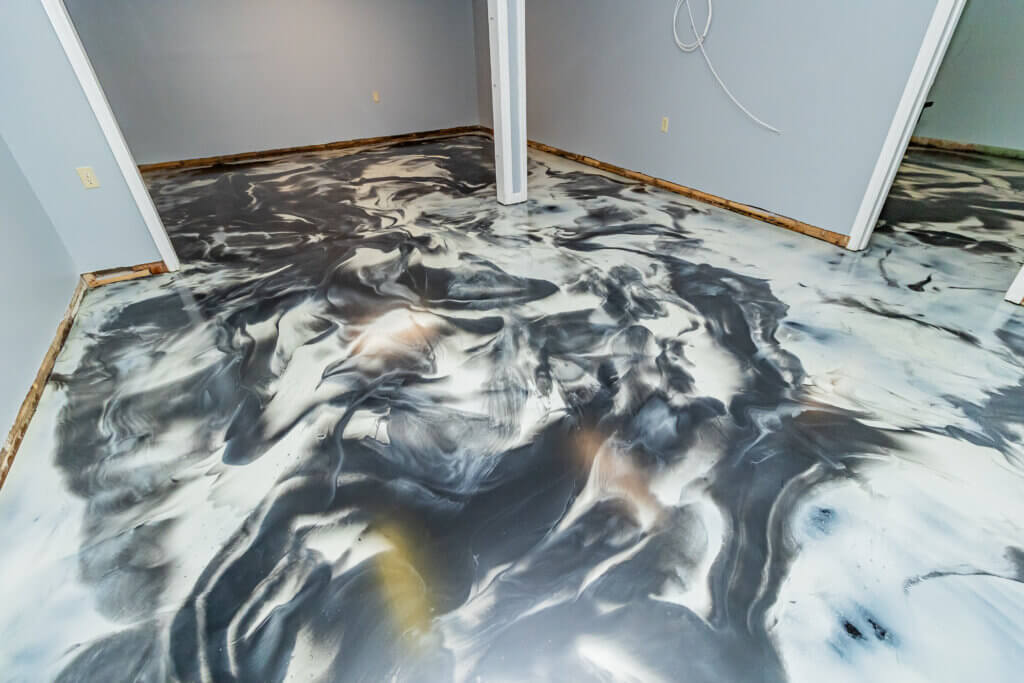 Ultra White, Dolphin and black metallic basement floor installed in 3 days by Epoxy Floor Experts in Fleetwood, PA